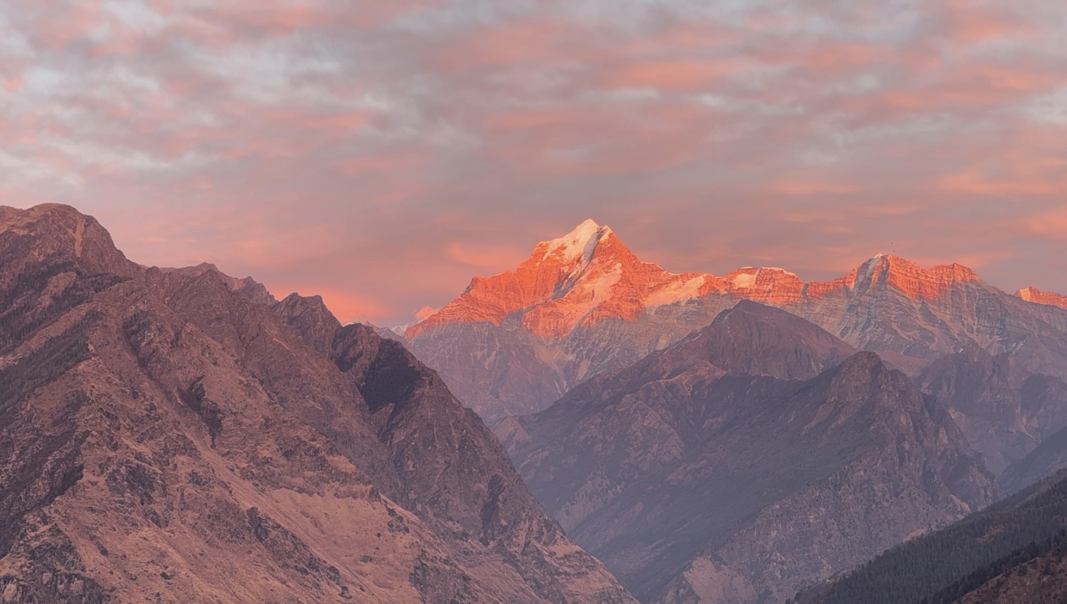 Alpine glow on the mountains from camp